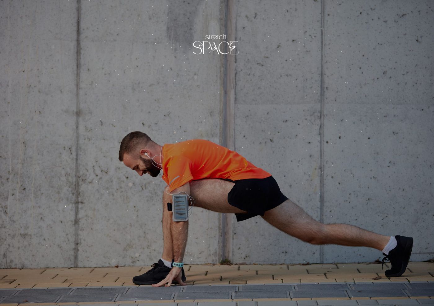 Specialist moving a client's leg through a slow, controlled arc during an assisted mobility session