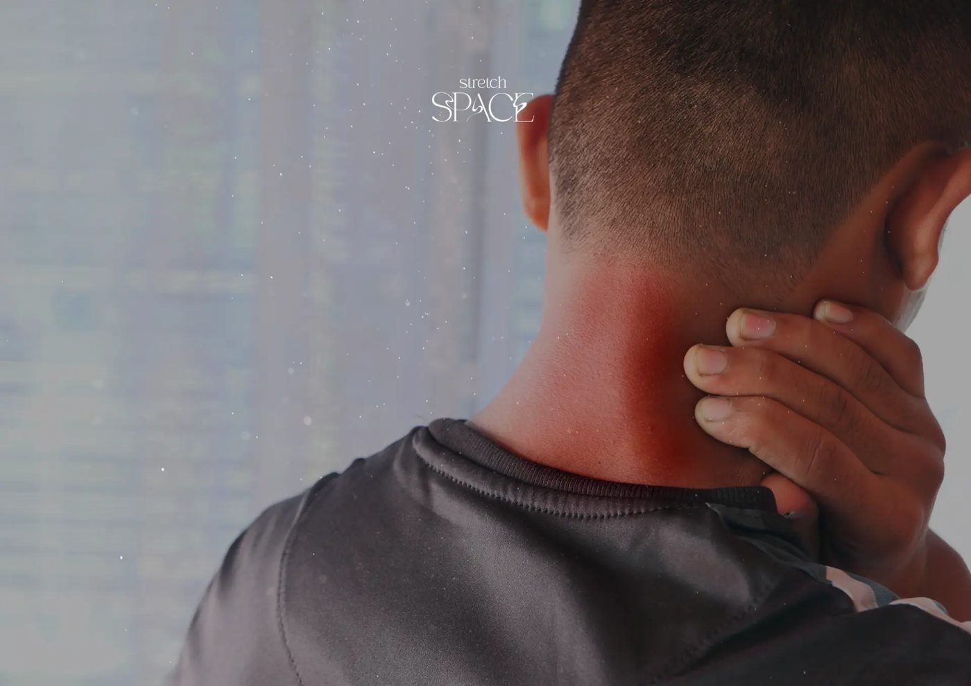 Close-up of a specialist guiding a client's neck and shoulders into a gentle assisted stretch